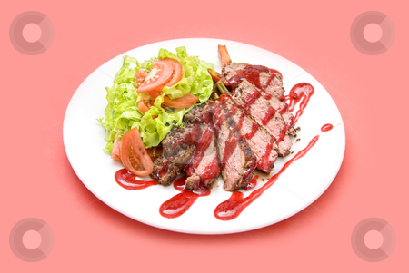 Meat Meat stock photo, Roasted Beef meat at cranberries sauce with vegetables by olinchuk
