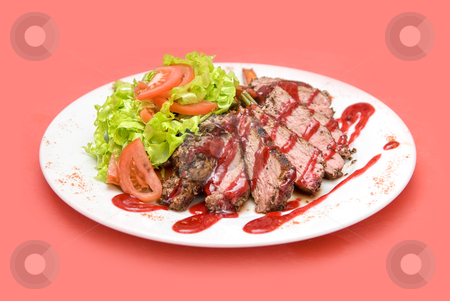 Meat Meat stock photo, Roasted Beef meat at cranberries sauce with vegetables by olinchuk