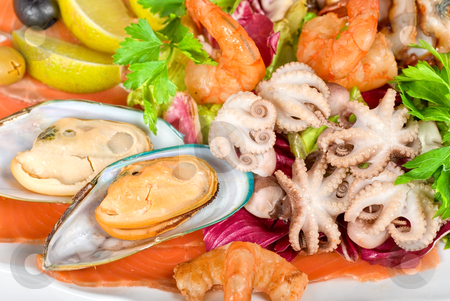 To use this stock image in your creative project, please select the size you need over to the right and click the "Add to Cart" button.
Your downloaded image will come with the Cutcaster watermark removed so don’t worry about the watermark you see on this page. Seafood salad stock photo, appetizer closeup of different seafood and vegetables by olinchuk
