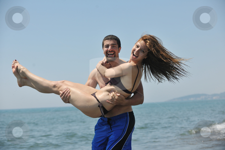 To use this stock image in your creative project, please select the size you need over to the right and click the "Add to Cart" button.
Your downloaded image will come with the Cutcaster watermark removed so don’t worry about the watermark you see on this page. Happy young couple have fun on beach stock photo, happy young couple have fun and romantic moments on beach at summer season and representing happynes and travel concept by Benis Arapovic