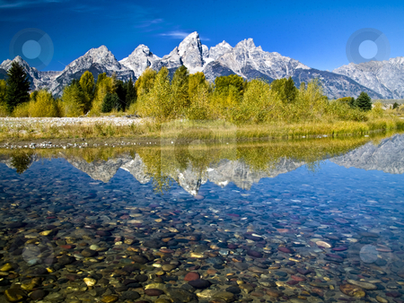To use this stock image in your creative project, please select the size you need over to the right and click the "Add to Cart" button.
Your downloaded image will come with the Cutcaster watermark removed so don’t worry about the watermark you see on this page. Grand Teton Reflection stock photo, Grand Tetons from Schwabachers Landing by Brian Johnson