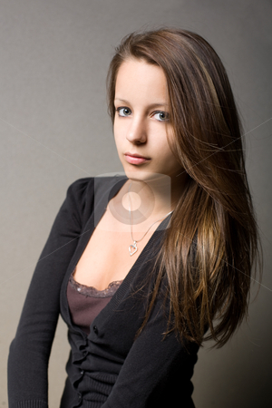 Contemplative young brunette girl. Contemplative young brunette girl. stock photo, Moody portrait of contemplative, sad looking young brunette girl. by exvivo