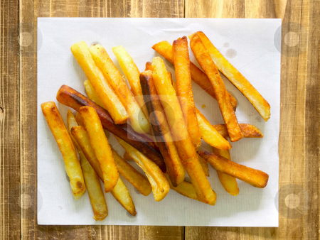 French fries on paper French fries on paper stock photo, close up of french fries on paper by zkruger