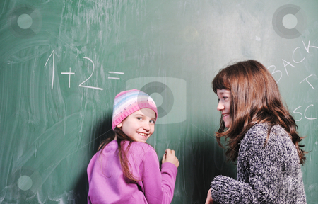 To use this stock image in your creative project, please select the size you need over to the right and click the "Add to Cart" button.
Your downloaded image will come with the Cutcaster watermark removed so don’t worry about the watermark you see on this page. Happy young school girl portrait stock photo, happy young school girl portrait on math class by Benis Arapovic