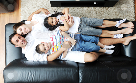 Young family at home Young family at home stock photo, happy young family relax and have fun at modern home indooor by Benis Arapovic