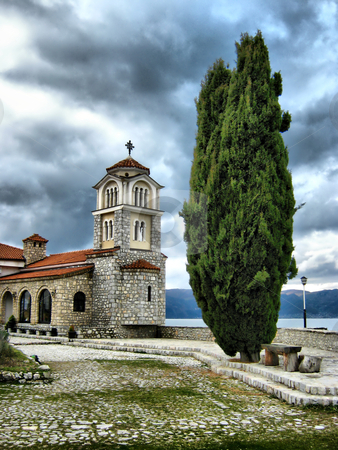 To use this stock image in your creative project, please select the size you need over to the right and click the "Add to Cart" button.
Your downloaded image will come with the Cutcaster watermark removed so don’t worry about the watermark you see on this page. Bell tower stock photo, bell tower and Cypress Tree outside a Monastery of St.Naum-Ohrid by Mitko Peroski