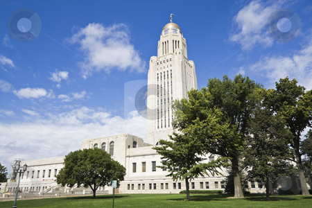 To use this stock image in your creative project, please select the size you need over to the right and click the "Add to Cart" button.
Your downloaded image will come with the Cutcaster watermark removed so don’t worry about the watermark you see on this page. Lincoln, Nebraska - State Capitol Building stock photo, Lincoln, Nebraska - State Capitol Building with the trees by Henryk Sadura