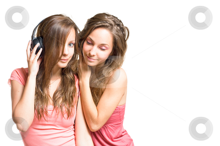 To use this stock image in your creative project, please select the size you need over to the right and click the "Add to Cart" button.
Your downloaded image will come with the Cutcaster watermark removed so don’t worry about the watermark you see on this page. Sharing the same tune. stock photo, Two gorgeous young brunette girls sharing a tune in their headphones, isolated on white background. by exvivo