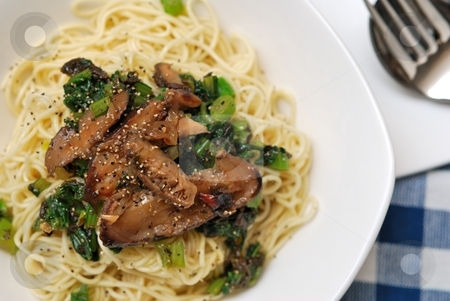 To use this stock image in your creative project, please select the size you need over to the right and click the "Add to Cart" button.
Your downloaded image will come with the Cutcaster watermark removed so don’t worry about the watermark you see on this page. Spicy mushroom delicacy stock photo, Yellow noodles served with generous topping of black mushrooms and sprinkled with black pepper. by Wai Chung Tang