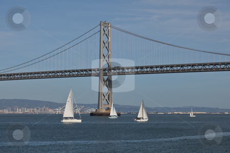 To use this stock image in your creative project, please select the size you need over to the right and click the "Add to Cart" button.
Your downloaded image will come with the Cutcaster watermark removed so don’t worry about the watermark you see on this page. Bay Bridge stock photo, The San Francisco – Oakland Bay Bridge is a pair of bridges spanning San Francisco Bay of California, in the United States. by Mariusz Jurgielewicz