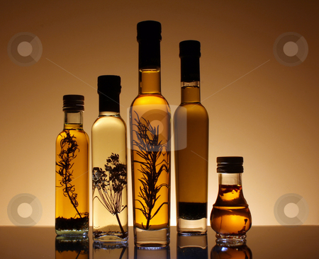 To use this stock image in your creative project, please select the size you need over to the right and click the "Add to Cart" button.
Your downloaded image will come with the Cutcaster watermark removed so don’t worry about the watermark you see on this page. Collection of bottles of olive oil. stock photo, Collection of bottles of olive oil illuminated from behind and underneath the bottles. The botles has olive oil with peper, rosemary and other seasonings. by marphotography