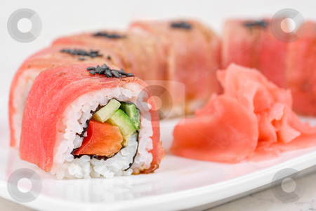 To use this stock image in your creative project, please select the size you need over to the right and click the "Add to Cart" button.
Your downloaded image will come with the Cutcaster watermark removed so don’t worry about the watermark you see on this page. Fuji Sushi rolls stock photo, Fuji Sushi rolls made of tuna, pepper, avocado, cucumber by olinchuk