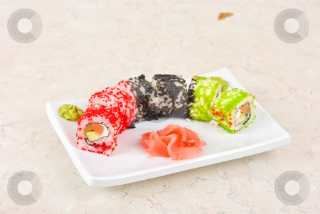 Sushi rolls Sushi rolls stock photo, Sushi rolls made of fish avocado and different flying fish roe (tobiko caviar) by olinchuk