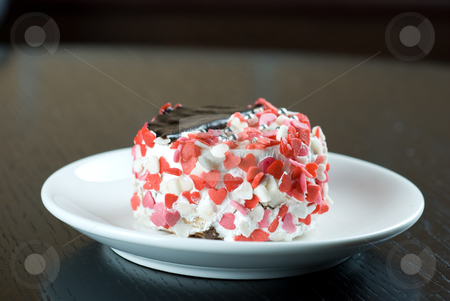 To use this stock image in your creative project, please select the size you need over to the right and click the "Add to Cart" button.
Your downloaded image will come with the Cutcaster watermark removed so don’t worry about the watermark you see on this page. Cupcake stock photo, fresh baked cupcake with hearts on a wooden table by olinchuk