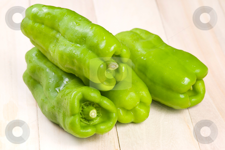 To use this stock image in your creative project, please select the size you need over to the right and click the "Add to Cart" button.
Your downloaded image will come with the Cutcaster watermark removed so don’t worry about the watermark you see on this page. Group of green bell peppers stock photo, group of green bell peppers on wooden background by Lawren