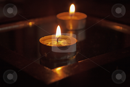 To use this stock image in your creative project, please select the size you need over to the right and click the "Add to Cart" button.
Your downloaded image will come with the Cutcaster watermark removed so don’t worry about the watermark you see on this page. Candles stock photo, Close up of a candle, with another on the back by Fabio Alcini