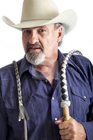 To use this stock image in your creative project, please select the size you need over to the right and click the "Add to Cart" button.
Your downloaded image will come with the Cutcaster watermark removed so don’t worry about the watermark you see on this page. Cowboy with bullwhip ready to work stock photo, Cowboy holding a bullwhip around his shoulder. Isolated on white by RCarner Photography