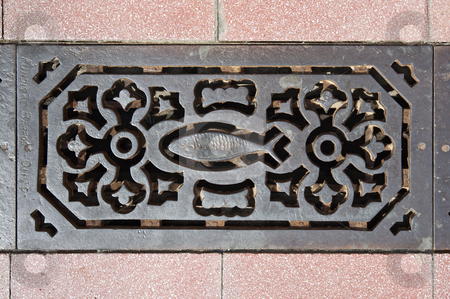 Sewer grate Sewer grate stock photo, Decorated sewer grate in a street of Vila Real de Santo Antonio, Algarve, Portugal by Manuel Ribeiro