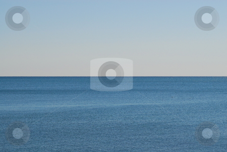 To use this stock image in your creative project, please select the size you need over to the right and click the "Add to Cart" button.
Your downloaded image will come with the Cutcaster watermark removed so don’t worry about the watermark you see on this page. Empty water horizon stock photo, Empty blue water with ripples against horizon. by ArchonCodex