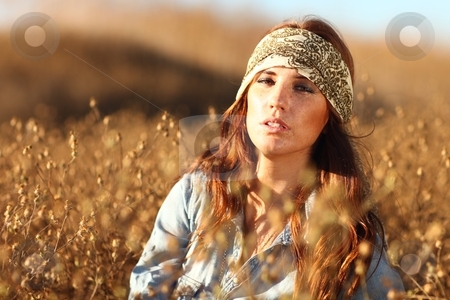 Beautiful Woman on a Field in Summertime Beautiful Woman on a Field in Summertime stock photo, Young Beautiful Woman in a Field During Summertime by Katrina Brown