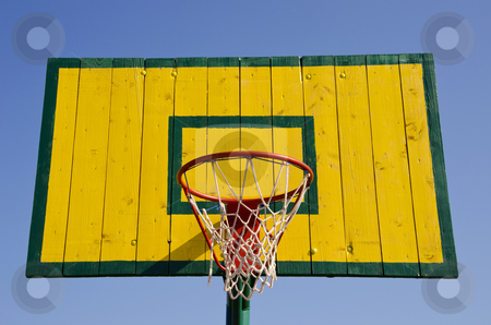 To use this stock image in your creative project, please select the size you need over to the right and click the "Add to Cart" button.
Your downloaded image will come with the Cutcaster watermark removed so don’t worry about the watermark you see on this page. Basketball board stock photo, Basketball board painted green and yellow with net on the hoop. by sauletas