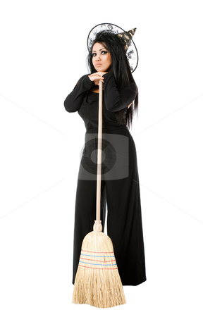 Witch with broom Witch with broom stock photo, Young female with witch costume standing on white background, leaning on broom by vilevi