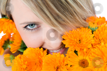To use this stock image in your creative project, please select the size you need over to the right and click the "Add to Cart" button.
Your downloaded image will come with the Cutcaster watermark removed so don’t worry about the watermark you see on this page. Woman eye bouqet stock photo, Close-up of beautiful female face holding marigolds, colourfull eye looking at camera by vilevi