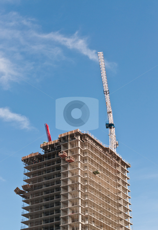 High Rise Building Under Construction High Rise Building Under Construction stock photo, A high rise building under construction with tower crane. by Brian Guest