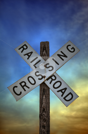To use this stock image in your creative project, please select the size you need over to the right and click the "Add to Cart" button.
Your downloaded image will come with the Cutcaster watermark removed so don’t worry about the watermark you see on this page. Railroad Crossing Sign stock photo, A close up shot of an old railroad crossing sign against a beautiful sunset sky. by macropixel