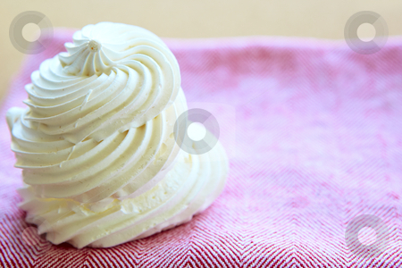 Tasty white meringue on a napkin. Tasty white meringue on a napkin. stock photo, Tasty white meringue on a pink napkin with copy space. by lubavnel