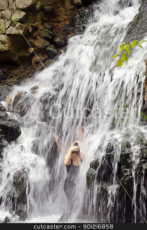 To use this stock image in your creative project, please select the size you need over to the right and click the "Add to Cart" button.
Your downloaded image will come with the Cutcaster watermark removed so don’t worry about the watermark you see on this page. Refreshing under waterfall. stock photo, Two youth refreshing under the flow of small waterfall in hot day. by sauletas