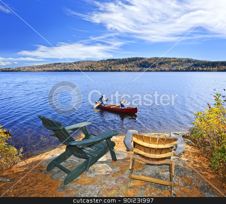 To use this stock image in your creative project, please select the size you need over to the right and click the "Add to Cart" button.
Your downloaded image will come with the Cutcaster watermark removed so don’t worry about the watermark you see on this page. Canoeing on lake stock photo, People returning from canoe trip on Lake of Two Rivers, Ontario, Canada by Elena Elisseeva