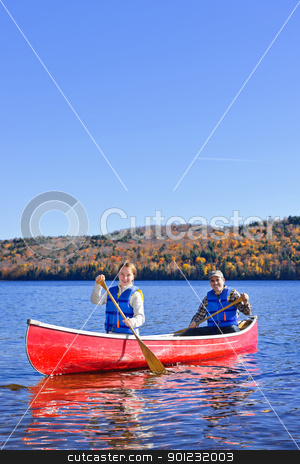 To use this stock image in your creative project, please select the size you need over to the right and click the "Add to Cart" button.
Your downloaded image will come with the Cutcaster watermark removed so don’t worry about the watermark you see on this page. Canoe trip on scenic lake in fall stock photo, Family canoeing on Lake of Two Rivers, Ontario, Canada by Elena Elisseeva