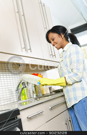 To use this stock image in your creative project, please select the size you need over to the right and click the "Add to Cart" button.
Your downloaded image will come with the Cutcaster watermark removed so don’t worry about the watermark you see on this page. Young woman washing dishes stock photo, Smiling young black woman washing dishes in kitchen by Elena Elisseeva