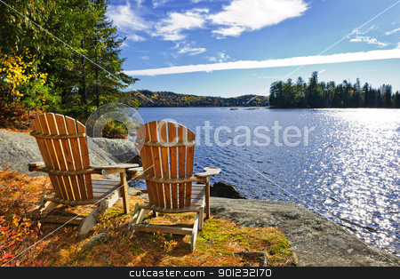 To use this stock image in your creative project, please select the size you need over to the right and click the "Add to Cart" button.
Your downloaded image will come with the Cutcaster watermark removed so don’t worry about the watermark you see on this page. Adirondack chairs at lake shore stock photo, Adirondack chairs at shore of Lake of Two Rivers, Ontario, Canada by Elena Elisseeva