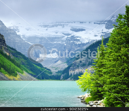 To use this stock image in your creative project, please select the size you need over to the right and click the "Add to Cart" button.
Your downloaded image will come with the Cutcaster watermark removed so don’t worry about the watermark you see on this page. Lake Louise with mountains stock photo, Landscape of beautiful Lake Louise and mountains in Alberta, Canada by Elena Elisseeva