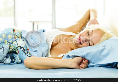 To use this stock image in your creative project, please select the size you need over to the right and click the "Add to Cart" button.
Your downloaded image will come with the Cutcaster watermark removed so don’t worry about the watermark you see on this page. Young woman waking up stock photo, Woman waking up stretching in bed with morning sunshine by Elena Elisseeva