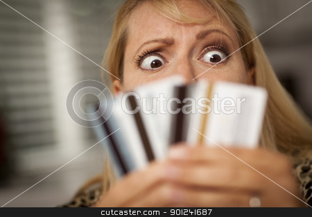 To use this stock image in your creative project, please select the size you need over to the right and click the "Add to Cart" button.
Your downloaded image will come with the Cutcaster watermark removed so don’t worry about the watermark you see on this page. Upset Woman Glaring At Her Many Credit Cards stock photo, Upset Robed Woman Glaring At Her Many Credit Cards. by Andy Dean