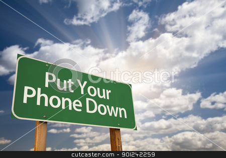 To use this stock image in your creative project, please select the size you need over to the right and click the "Add to Cart" button.
Your downloaded image will come with the Cutcaster watermark removed so don’t worry about the watermark you see on this page. Put Your Phone Down Green Road Sign stock photo, Put Your Phone Down Green Road Sign with Dramatic Sky, Clouds and Sun. by Andy Dean