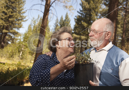 To use this stock image in your creative project, please select the size you need over to the right and click the "Add to Cart" button.
Your downloaded image will come with the Cutcaster watermark removed so don’t worry about the watermark you see on this page. Attractive Senior Couple Overlooking Potted Plants stock photo, Attractive Senior Couple Overlooking Potted Plants at the Nursery. by Andy Dean