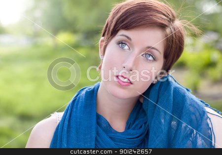 To use this stock image in your creative project, please select the size you need over to the right and click the "Add to Cart" button.
Your downloaded image will come with the Cutcaster watermark removed so don’t worry about the watermark you see on this page. Pretty Blue Eyed Young Red Haired Adult Female Outdoor Portrait stock photo, Outdoor Portrait of Pretty Blue Eyed Young Red Haired Adult Female with Blue Scarf. by Andy Dean