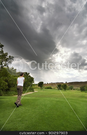 To use this stock image in your creative project, please select the size you need over to the right and click the "Add to Cart" button.
Your downloaded image will come with the Cutcaster watermark removed so don’t worry about the watermark you see on this page. Teeing Off stock photo, A golfer at the tee by Tyler Olson