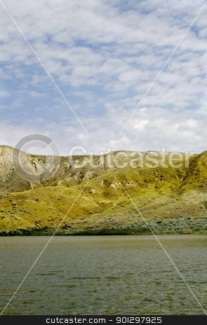 To use this stock image in your creative project, please select the size you need over to the right and click the "Add to Cart" button.
Your downloaded image will come with the Cutcaster watermark removed so don’t worry about the watermark you see on this page. River Hills stock photo, South Saskatchewan River Hills, on Diefenbaker Lake, near Beaver Flat by Tyler Olson