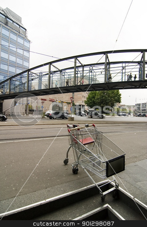 To use this stock image in your creative project, please select the size you need over to the right and click the "Add to Cart" button.
Your downloaded image will come with the Cutcaster watermark removed so don’t worry about the watermark you see on this page. Downtown Grunge Abstract stock photo, Downtown busy grunge abstract image with shopping cart in foreground by Tyler Olson