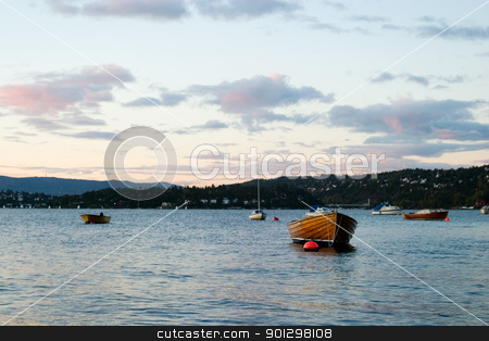 To use this stock image in your creative project, please select the size you need over to the right and click the "Add to Cart" button.
Your downloaded image will come with the Cutcaster watermark removed so don’t worry about the watermark you see on this page. Boat in Sunset stock photo, Boat at sunset on the norwegian coast, in the Oslo fjord. by Tyler Olson