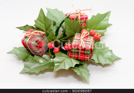 To use this stock image in your creative project, please select the size you need over to the right and click the "Add to Cart" button.
Your downloaded image will come with the Cutcaster watermark removed so don’t worry about the watermark you see on this page. Christmas Decoration stock photo, Mistletoe and Presents Christmas Decoration by Tyler Olson