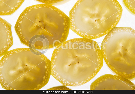 To use this stock image in your creative project, please select the size you need over to the right and click the "Add to Cart" button.
Your downloaded image will come with the Cutcaster watermark removed so don’t worry about the watermark you see on this page. Banana Slice Background stock photo, Banana slice texture image by Tyler Olson