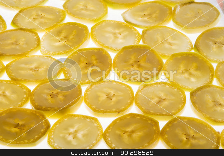 To use this stock image in your creative project, please select the size you need over to the right and click the "Add to Cart" button.
Your downloaded image will come with the Cutcaster watermark removed so don’t worry about the watermark you see on this page. Banana Slice Background stock photo, Banana slice texture image by Tyler Olson