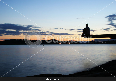 To use this stock image in your creative project, please select the size you need over to the right and click the "Add to Cart" button.
Your downloaded image will come with the Cutcaster watermark removed so don’t worry about the watermark you see on this page. Dock at Dusk stock photo, A young person sitting on a dock at dusk, at the fjord in Oslo, Norway by Tyler Olson