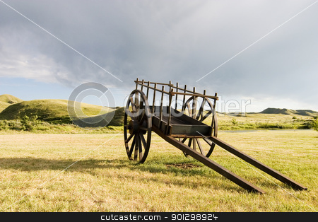 To use this stock image in your creative project, please select the size you need over to the right and click the "Add to Cart" button.
Your downloaded image will come with the Cutcaster watermark removed so don’t worry about the watermark you see on this page. Old Wooden Cart stock photo, An old wooden cart sitting on the pairies by Tyler Olson
